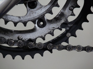 Close-up of the front chain ring or crankwheel of a bicycle.
