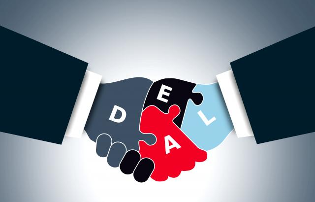 Hands shaking on a deal.